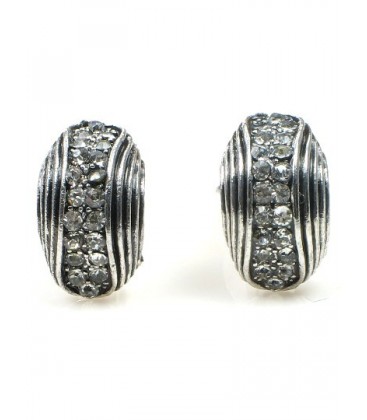 Metaalkleurige oorclips met heldere strass steentjes