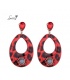 Rode / zwarte oorbellen met ovale hanger en steentjes