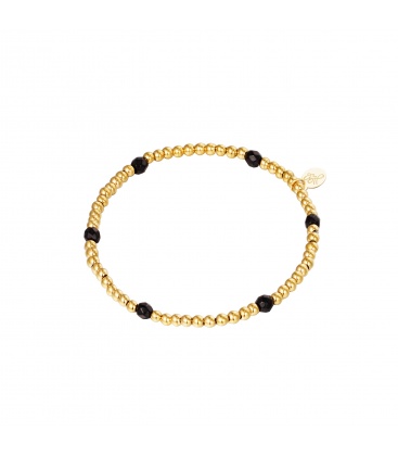 Kralenarmband goudkleurig met zwarte kralen met ruitendetails