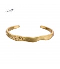 Goudkleurige spang armband 