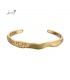 Goudkleurige spang armband 