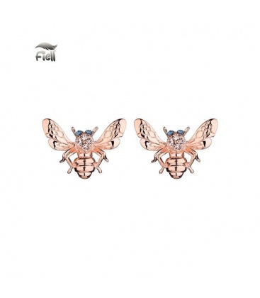 Goudkleurige oorknopjes in de vorm van een insect