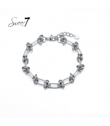 Zilverkleurige armband met schakels en knopen