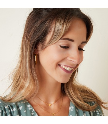 Goudkleurige ketting met een open klaver