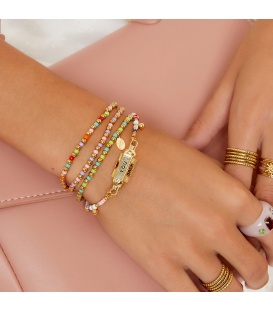 Armband met goudkleurige, paarse en roze kralen