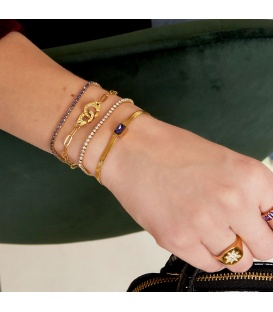Goudkleurige armband bezet met paarse zirkoonstenen