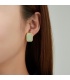 Groen gekleurde oorclips met een goudkleurige rand