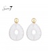 Witte oorhangers van raffia