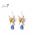 Blauwe oorhangers met een goudkleurig detail
