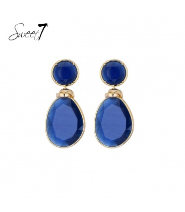 Blauwe oorhangers met een goudkleurige rand en knoop