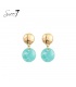 Turquoise oorhangers met een goudkleurige detail