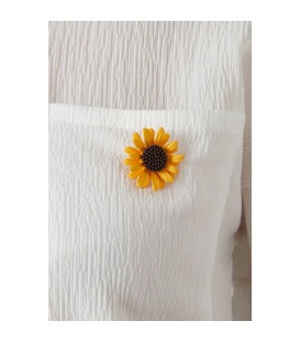 Goudgele broche in madelief vorm