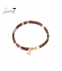 Terracotta armband met goudkleurige elementen