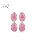 Roze oorhangers met cat eye stenen in goudkleurige setting