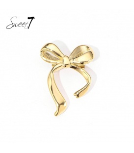 Goudkleurige broche met een elegante strik