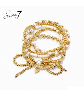 Goudkleurige armband met witte parels 