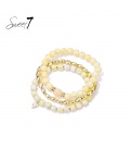 Armband set met lichtgele kralen en goudkleurige accenten