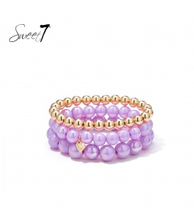 Armband set met paarse kralen en goudkleurige details