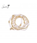 Armband met witte kralen en goudkleurige kralen
