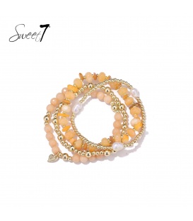 Armband met perzikkleurige kralen en meerdere strengen