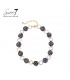 Halsketting donkerblauw met witte stippen en goudkleurige schakels