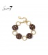 Armband bruin met stippen en goudkleurige schakels