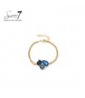 Armband met blauwe kristallen en goudkleurige schakel 