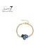 Armband met blauwe kristallen en goudkleurige schakel 