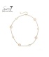 Halsketting met beige cat eye stenen en goudkleurige cirkels