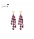 Oorbellen bordeaux rood met bloemen glas kralen en goudkleurige top